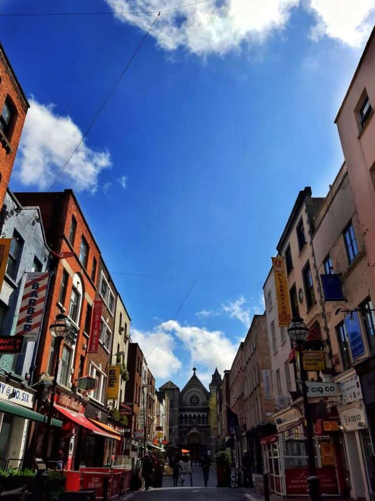 The view of the shop-lined streets of Grafton Street which is a popular shopping street in Dublin and also usually live music performers.