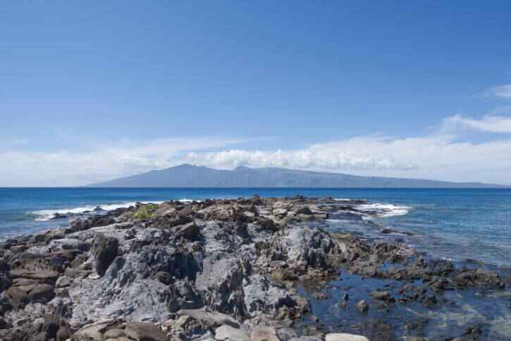 The rugged rocks jutting out of the shoreline at Kapalua Bay in Maui.