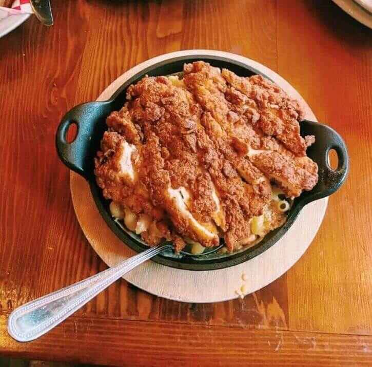 The mac and cheese served in a skillet and topped with fried chicken at the Eagle which is one of my favorite places to eat in Indianapolis.