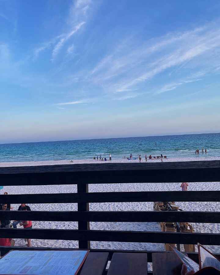 The pink and blue colors in the sky at sunset we could see while eating dinner at the Back Porch in Destin, Florida that has outdoor seating right up against the soft white sand beaches.