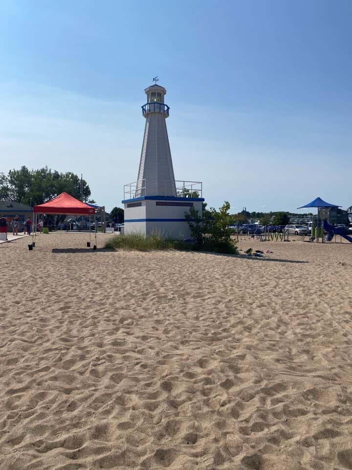 The beach in New Buffalo, Michigan with its tan sand and clear blue skies making it a popular day trip from Chicago to New Buffalo.