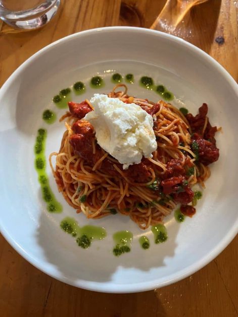 The angel hair pasta served with sun dried tomatoes, pesto sauce, and goat cheese at Trattoria Nervous Italian restaurant in Yorkville.