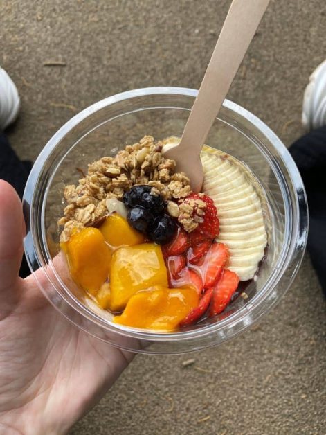 The delicious fresh fruit acai bowl topped with bananas, mangos, strawberries, and blueberries served at Chinchirorin cafe near Fushimi Inari Taisha shrine.