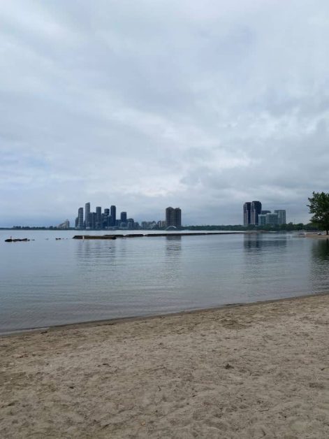 The view of the city of Mississauga across Lake Ontario you can see while relaxing on Sunnyside Beach in Toronto which is a popular spot for locals to hang out during the summer.