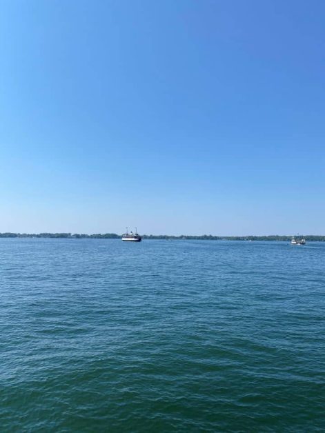 The view of Lake Ontario with sailing boats while you relax at Sugar Beach in Toronto.