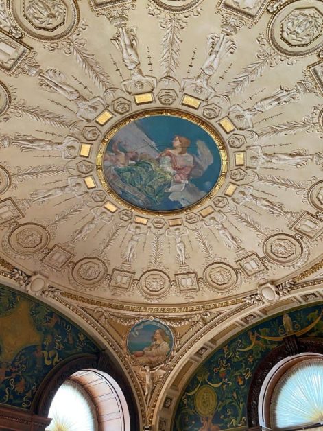 Detailed ceiling artwork and ornate architecture inside the Library of Congress, one of the most beautiful buildings in Washington DC.