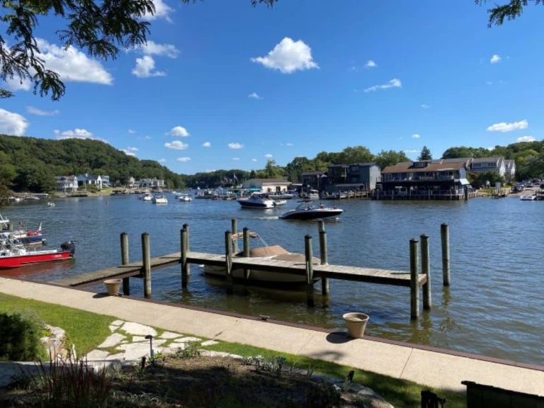 The view of the boats, Kalamazoo River, and downtown Saugatuck after taking the Saugatuck Chain Ferry over to Mt. Baldhead which is one of the most popular things to do in Saugatuck.