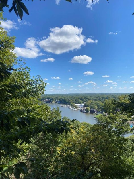 The view from the top of the stairs you climb to get to the top of Mt. Baldhead with views of the Kalamazoo River, Lake Michigan, and Saugatuck.