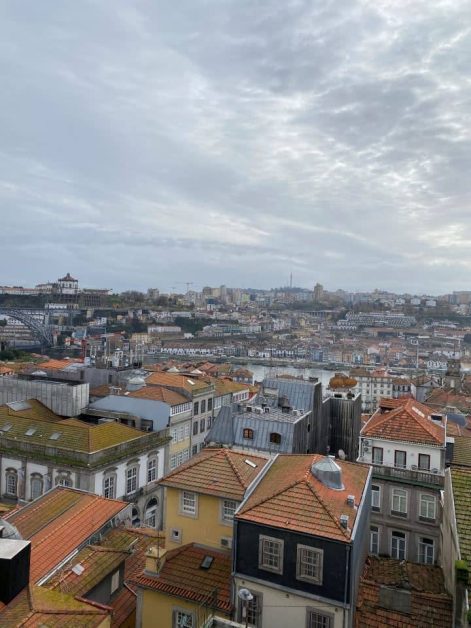 View of Porto from above at the Miradouro da Vitória viewpoint with tightly packed buildings and terracotta roofs.