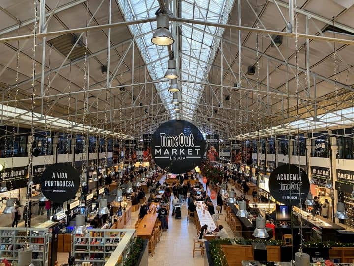 Time Out Market in Lisbon full of different food vendors making it a great spot for lunch or dinner while sightseeing.