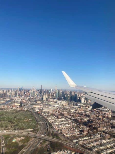 The view of the New York City skyline while flying into LaGuardia Airport sitting on the left side of the plane.