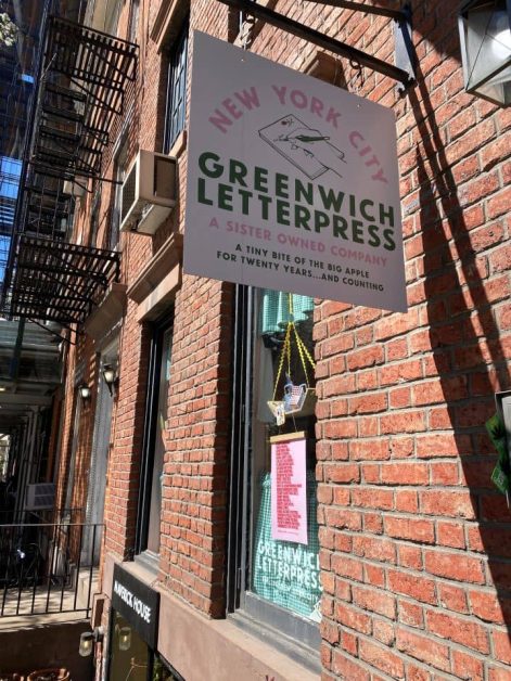 The red brick exterior of the Greenwich Letterpress store in New York City that sells cute stationery, greeting cards, and small trinkets.