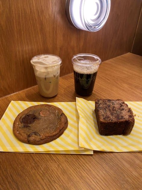 An iced maple sea latte, cold brew, chocolate chip cookie, and walnut banana brea from Hani's Bakery and Cafe in New York City.