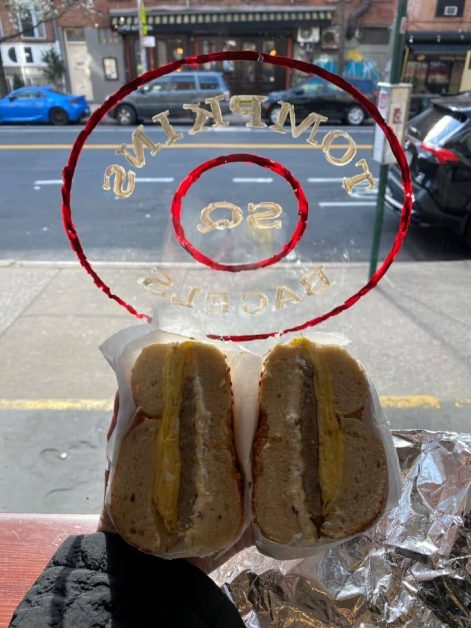 An onion bagel with sausage, egg, and scallion bacon cream cheese from Tompkins Square Bagels in New York City.
