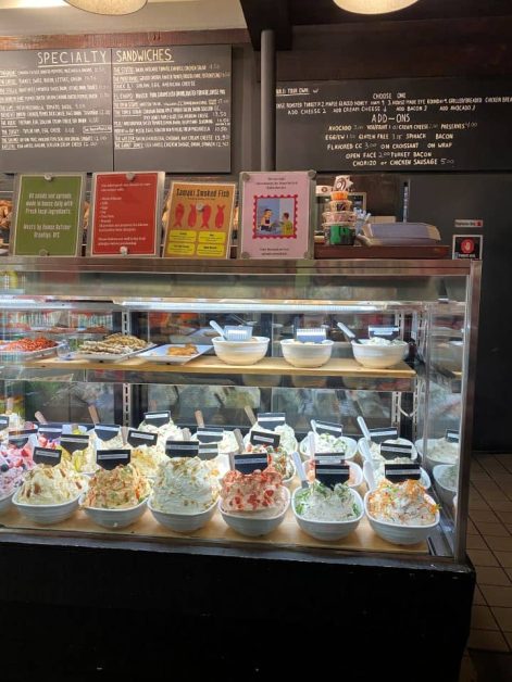 The large variety of cream cheese spreads on display at Tompkins Square Bagels in New York City.