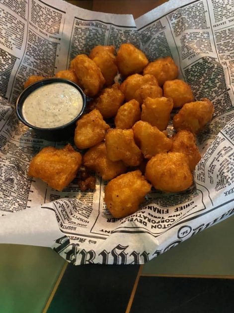 Basket of fried cheese curds with ranch dip from Flat Iron Tap in Lake Geneva, Wisconsin.
