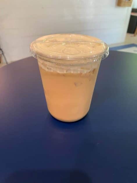 "Iced latte with cold foam in a clear cup from Lakeside Coffee near Lake Geneva, Wisconsin.