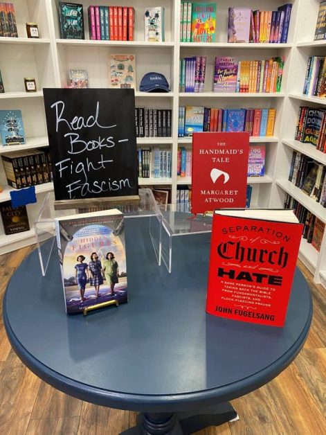 Display table of books, including The Handmaid's Tale and Hidden Figures, at Lakeside Books in Lake Geneva, Wisconsin.