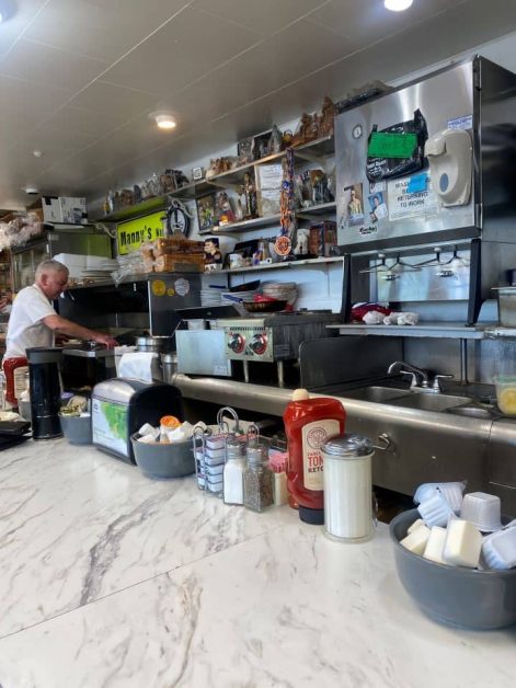 Cook working behind the counter at Manny's Snack Shack near Lake Geneva, Wisconsin.